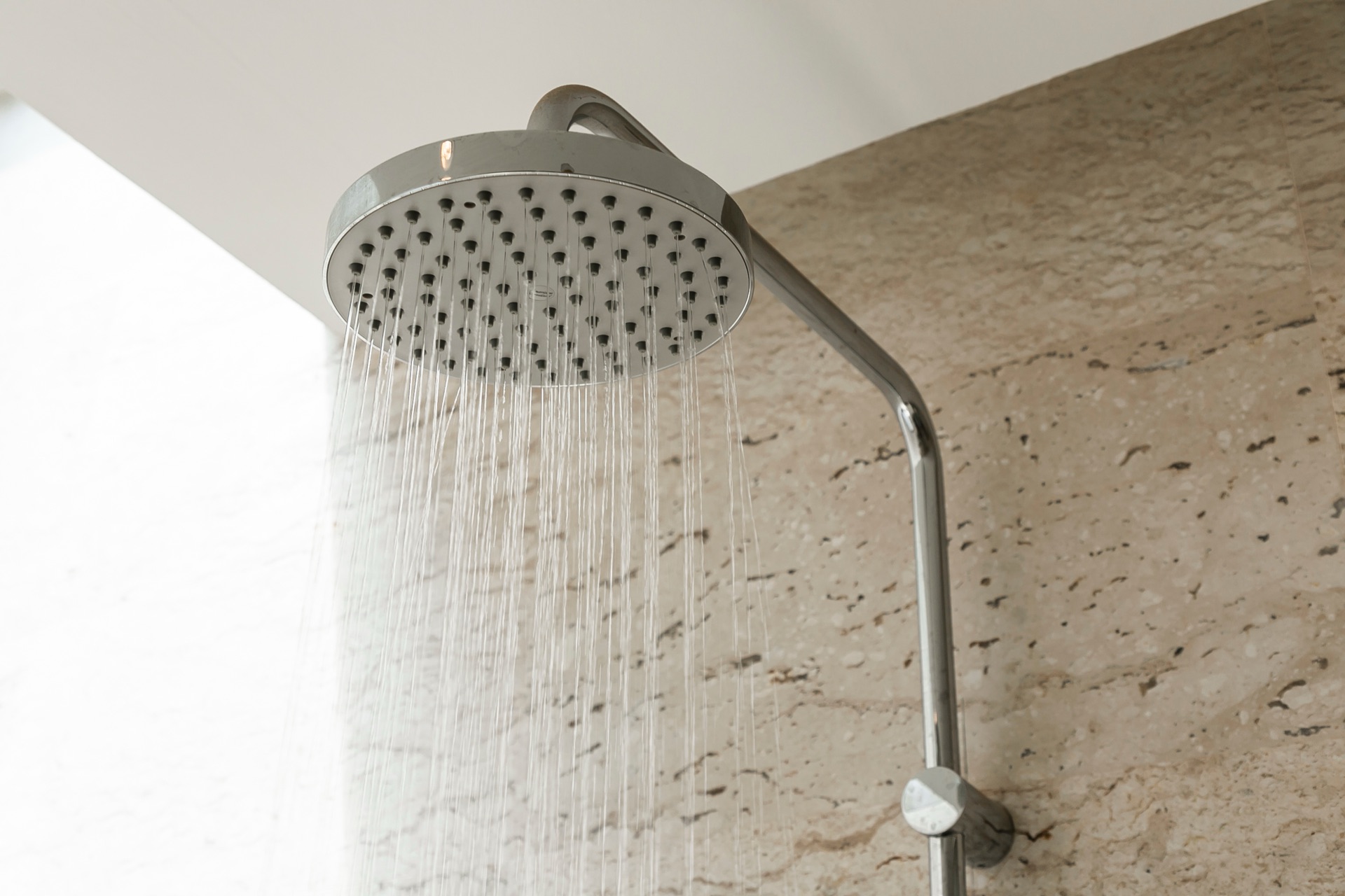 Crusty mineral scale on shower glass