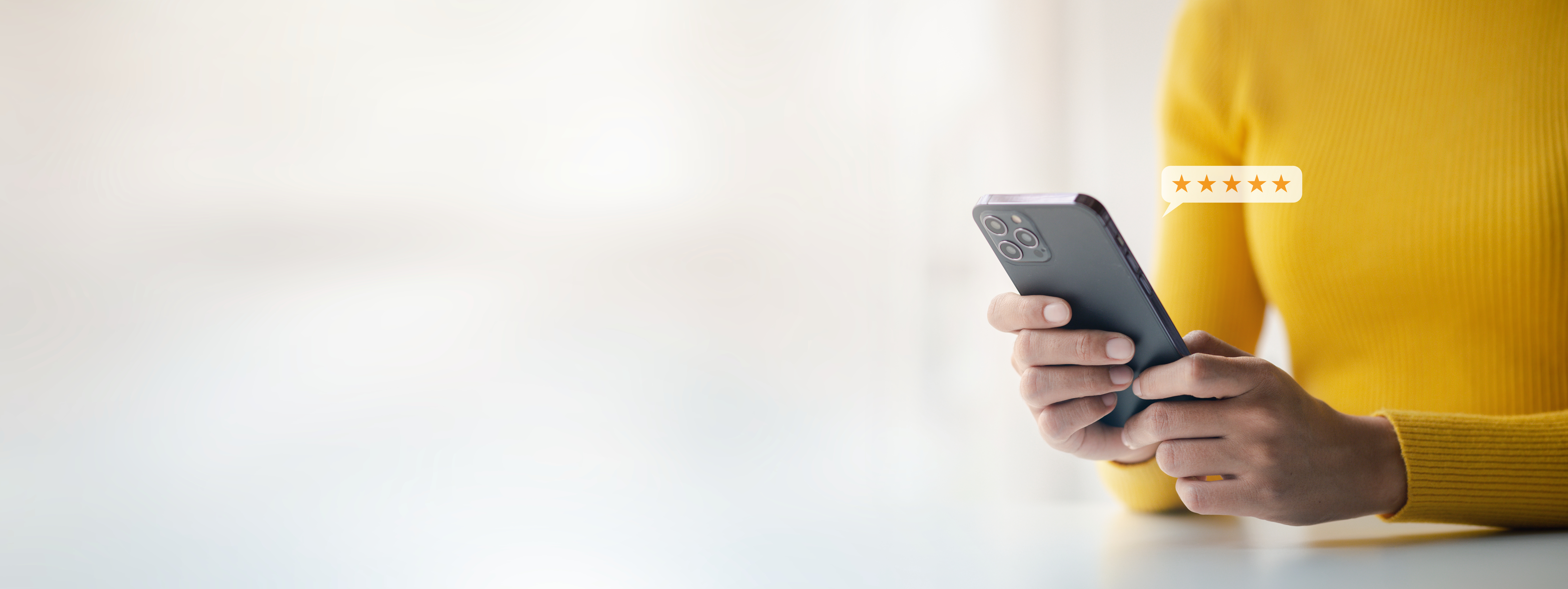 Woman leaving a five star review on her phone